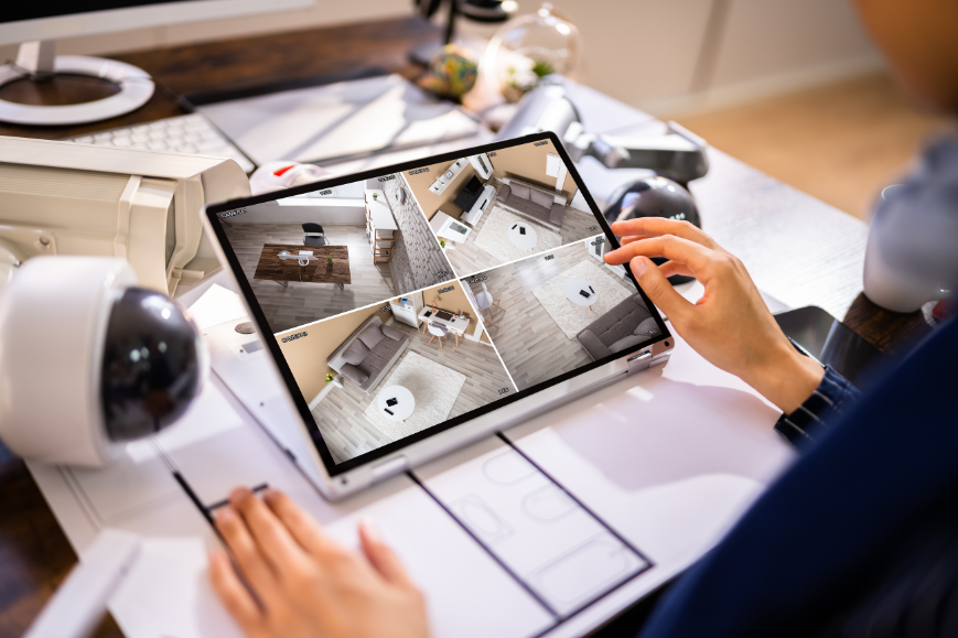Man monitoring home security camera using his tablet