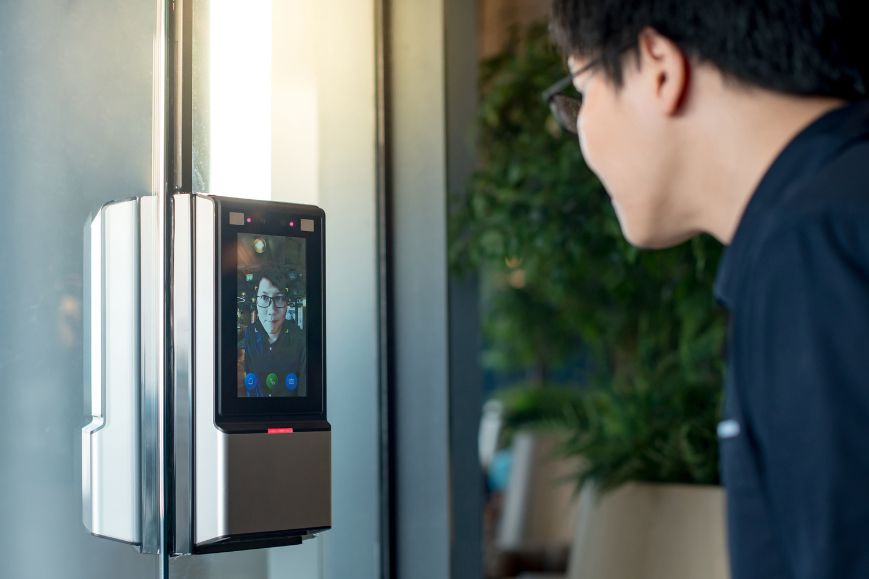 Man using a facial recognation camera 