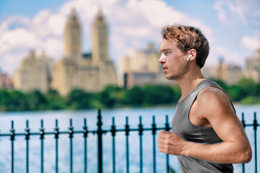 man running with earbuds