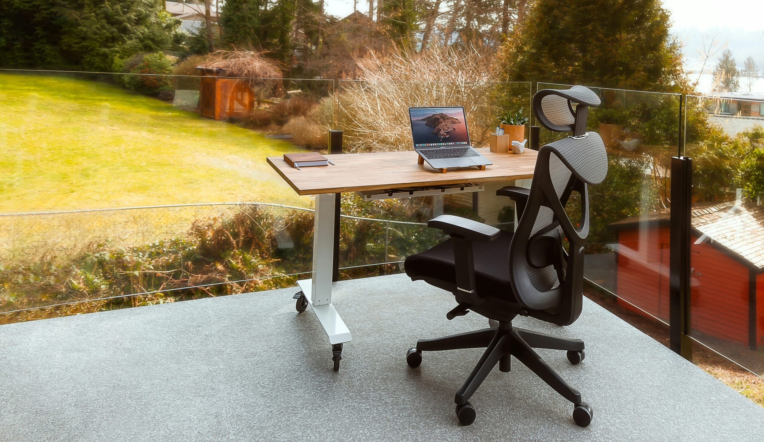An outdoor office set up with ergonomic table and ergonomic chair