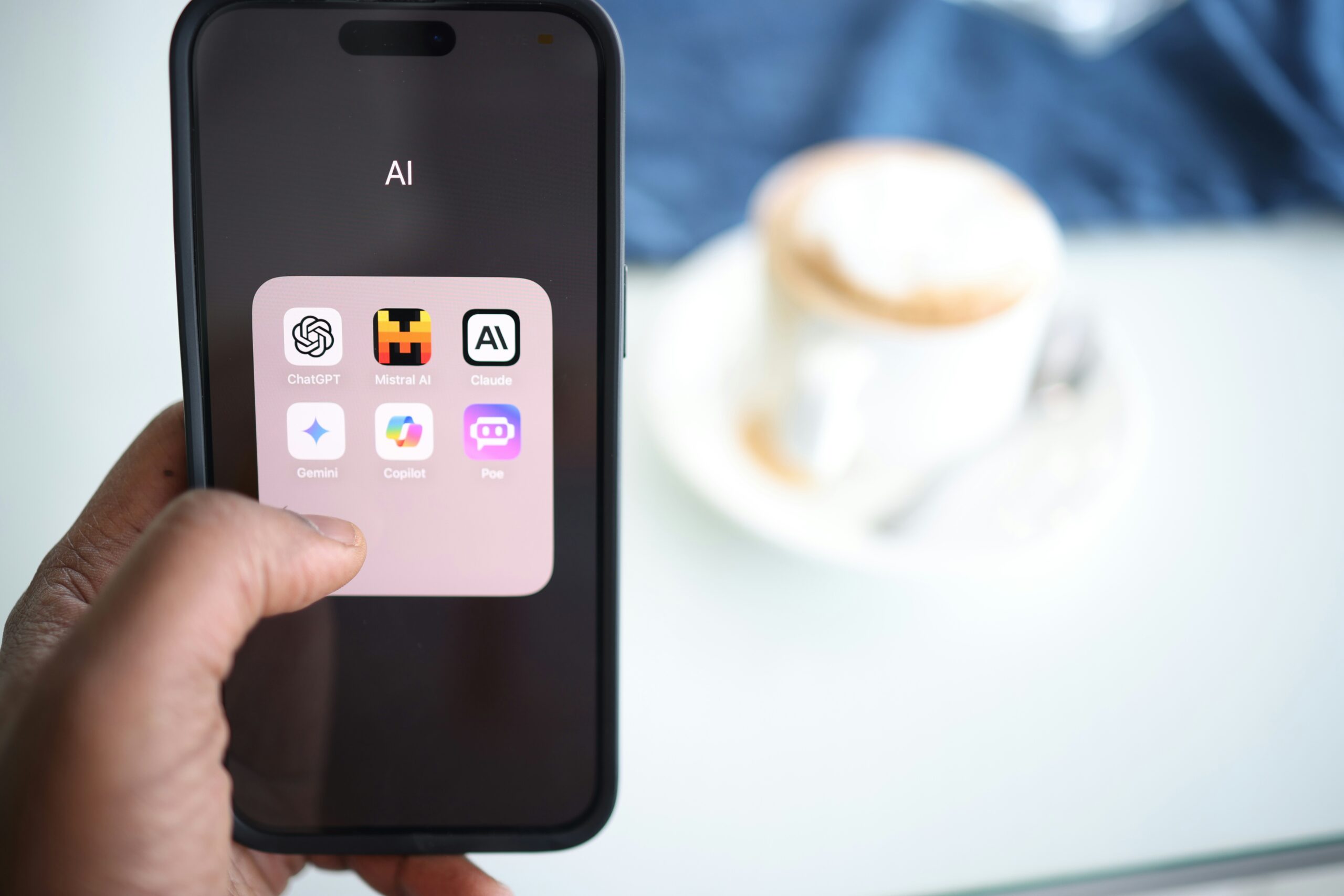 Image of a smartphone with a curated list of AI apps freelancers can use