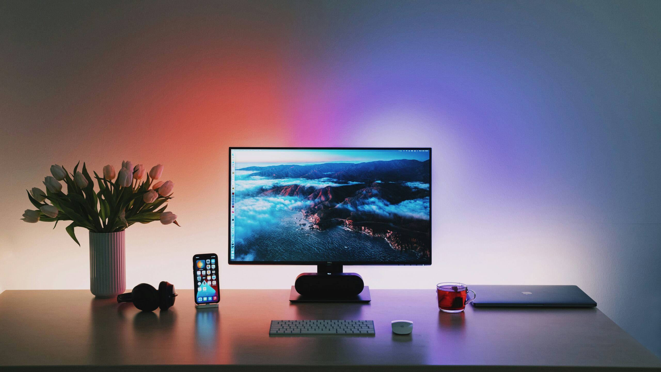 Desk setup with Philips Hue lights during the night.