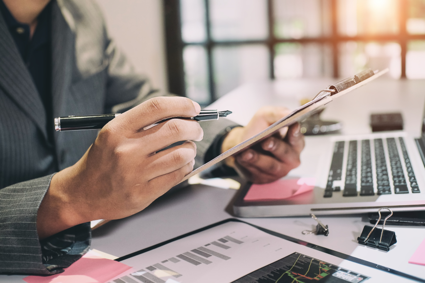 Audit concept, Bookkeeper or financial inspector and secretary making report