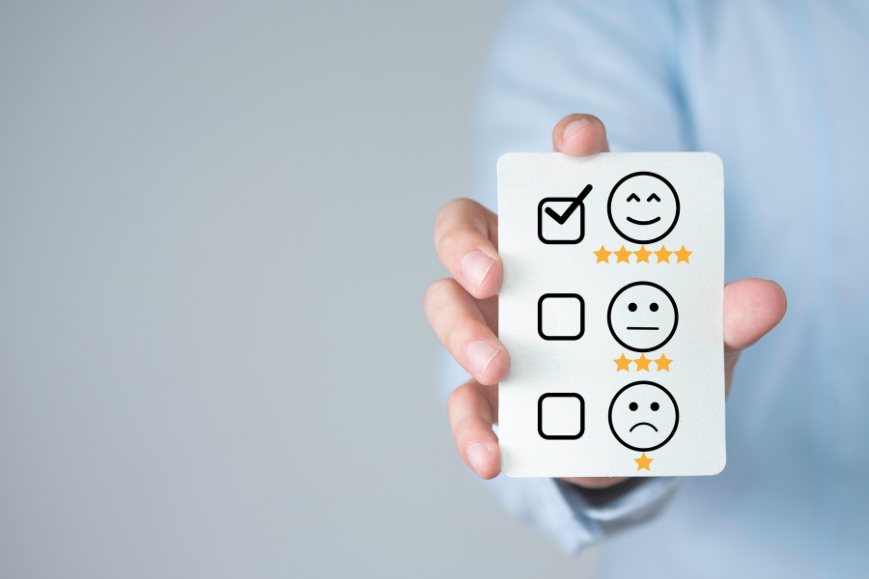 A paper card image with happy, normal, and sad emoji indicating different satisfaction rates