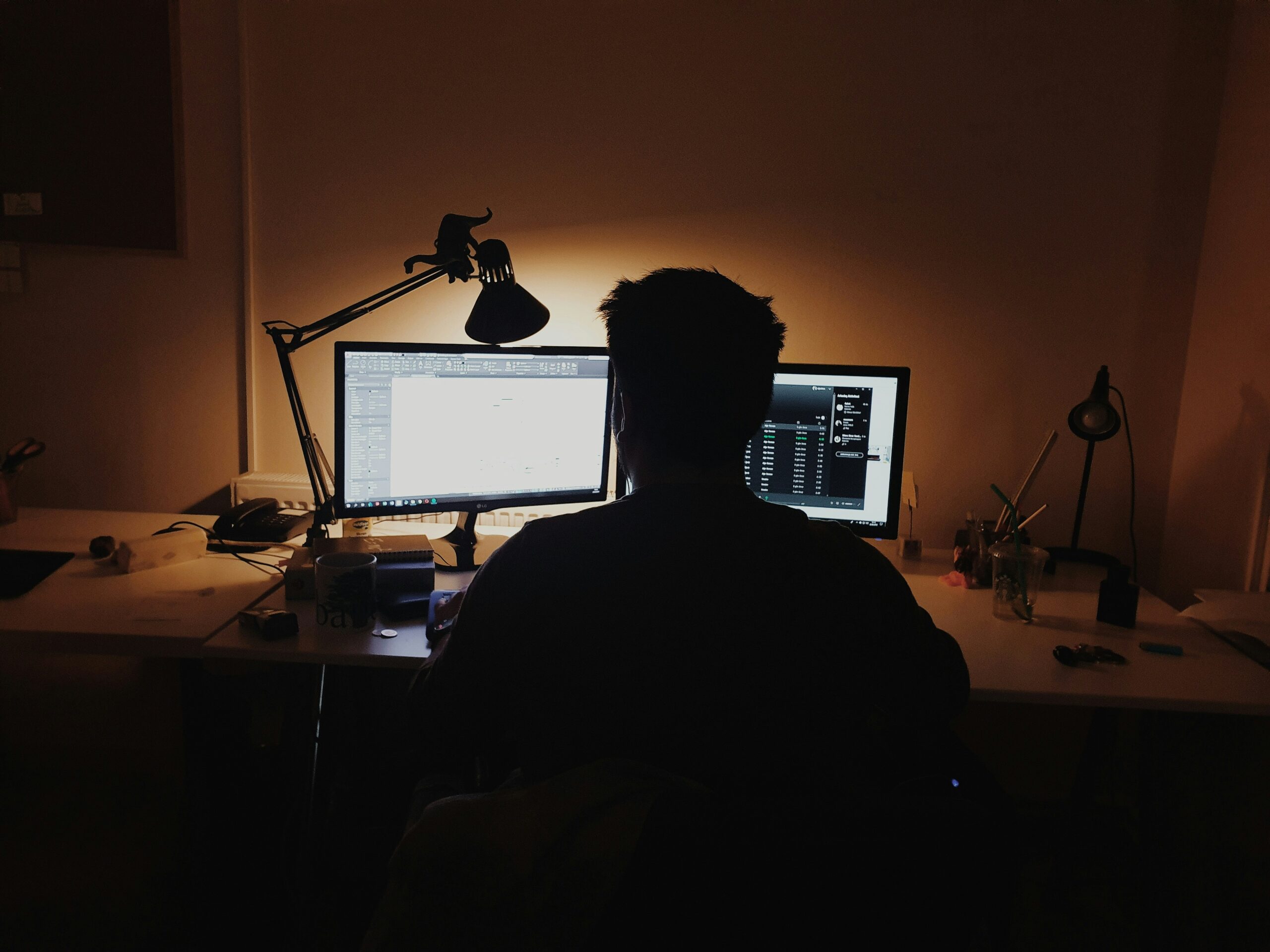 Man in an office doing some data monitoring